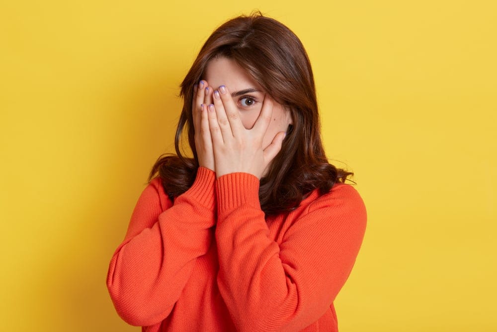 Woman looking shy.