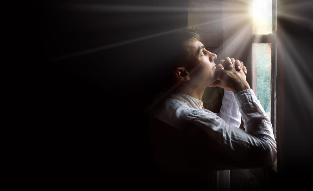 Man praying alone.