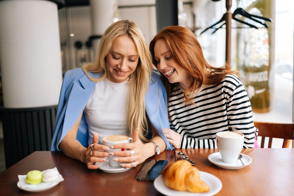 Two female friends having breakfast togetrher.
