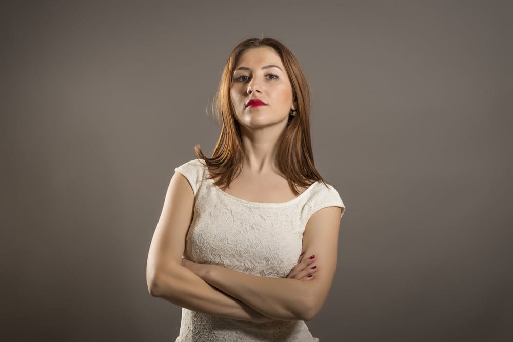 Angry woman crossing her arms.