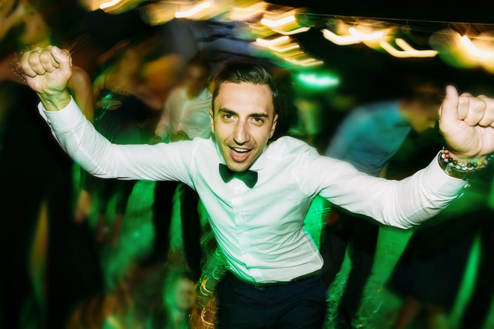 Man dancing in a tuxedo.
