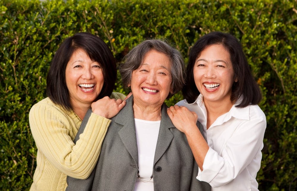 Senior woman with her two adult daughters