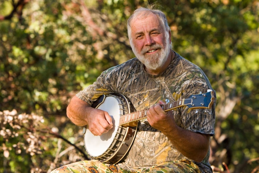Old man playing the banjo.
