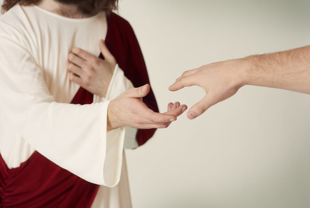 Jesus with an outreached hand.