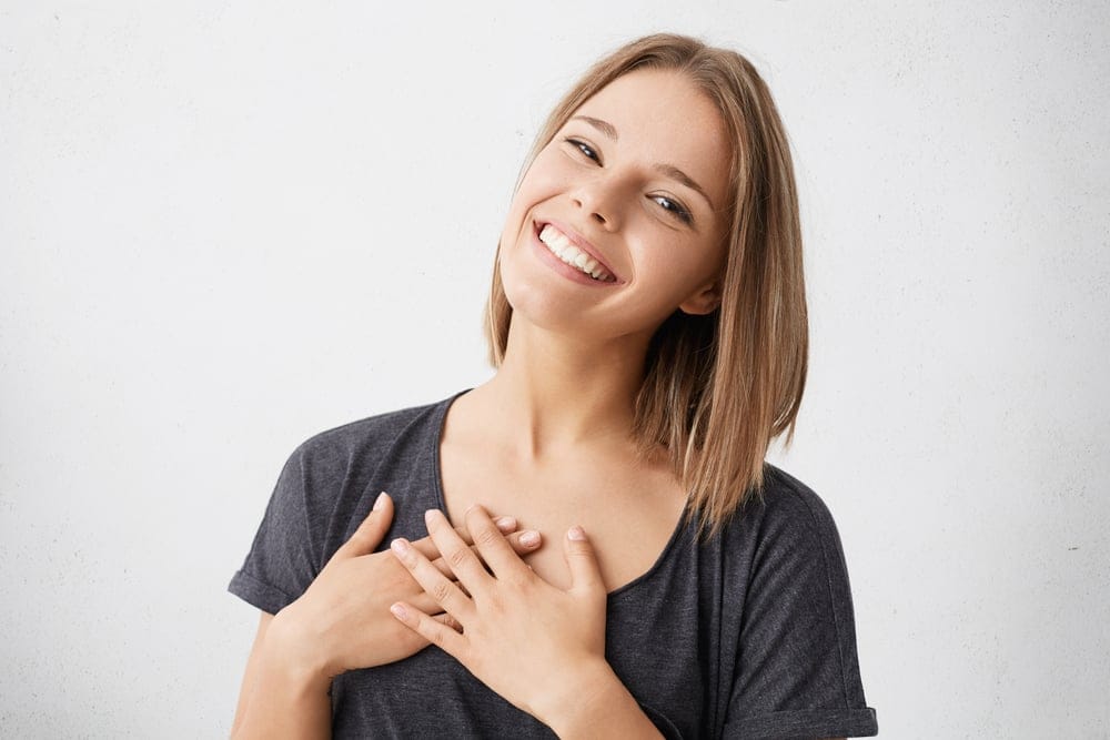 Smiling woman portraying perfection.