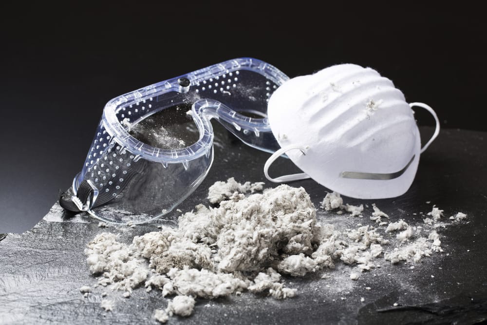 Asbestos with work goggles and a mask.