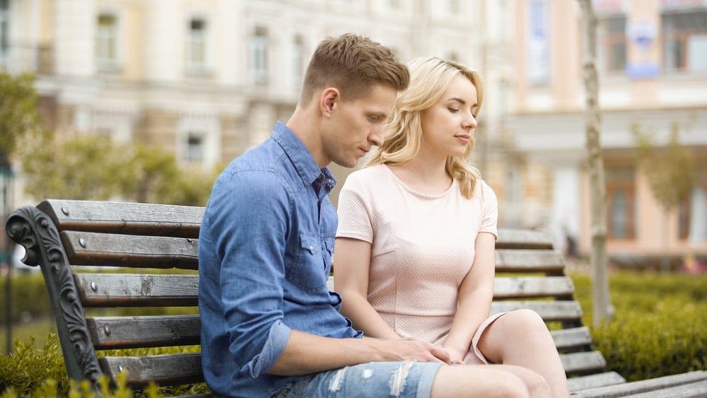 Couple,Feeling,Awkward,,Sitting,On,Bench,In,Silence,,Crisis,In