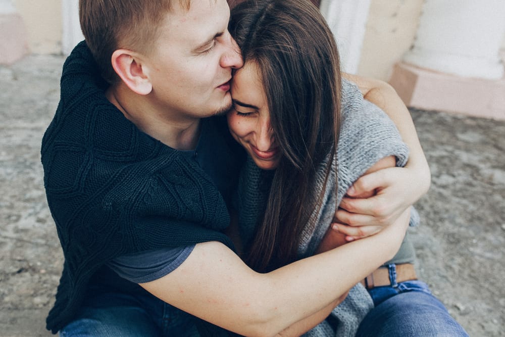 Couple showing affection toward one another.
