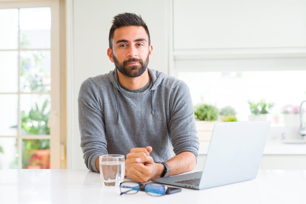 Man sitting at his computer.