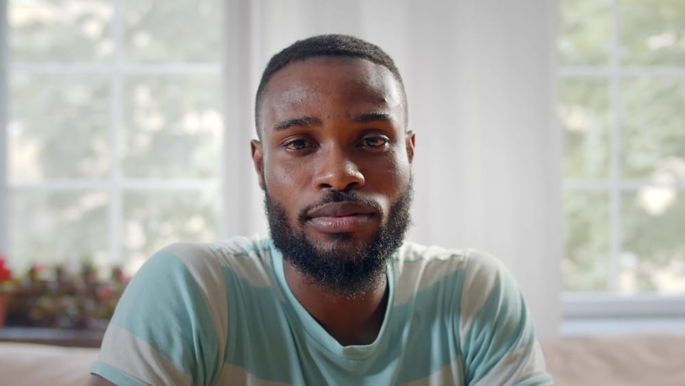 Man at home looking depressed.