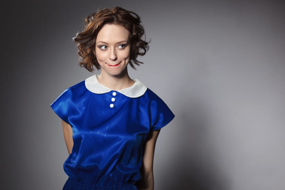 Woman dressed in a fancy shirt.