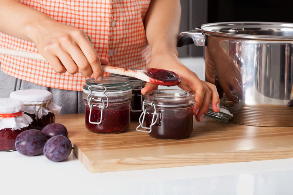 Woman making homemade jams.