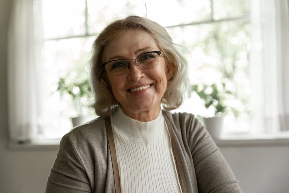Older woman looking confident and content.