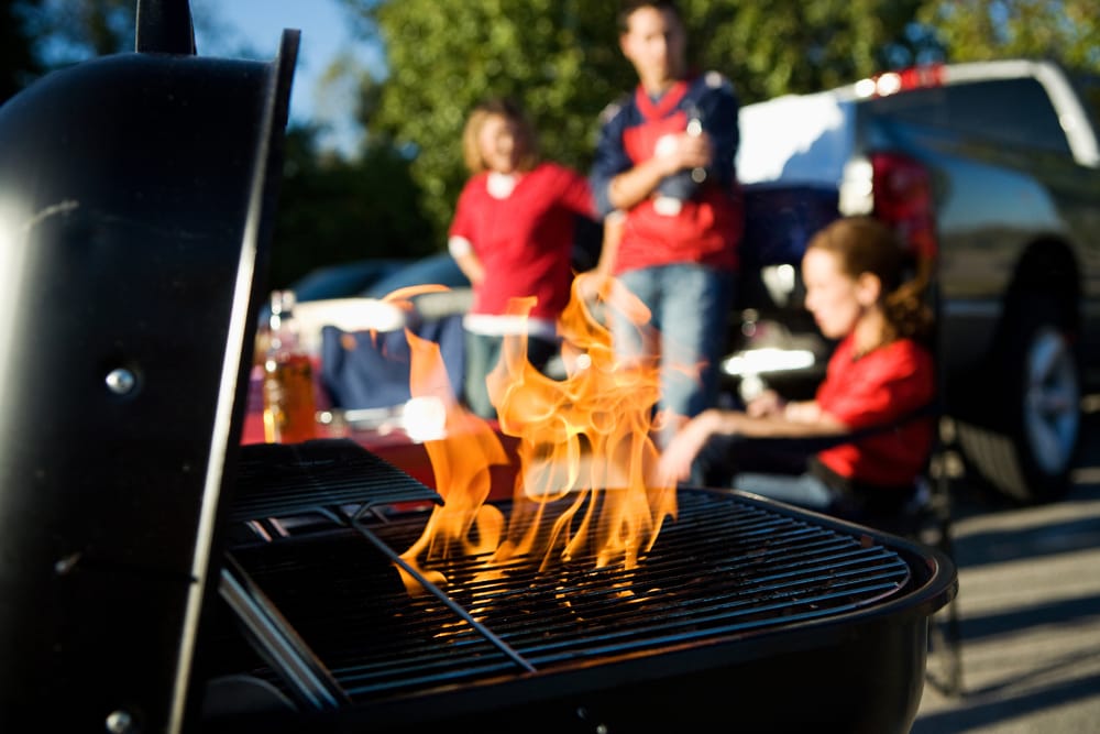 Men grilling at a tailgate.