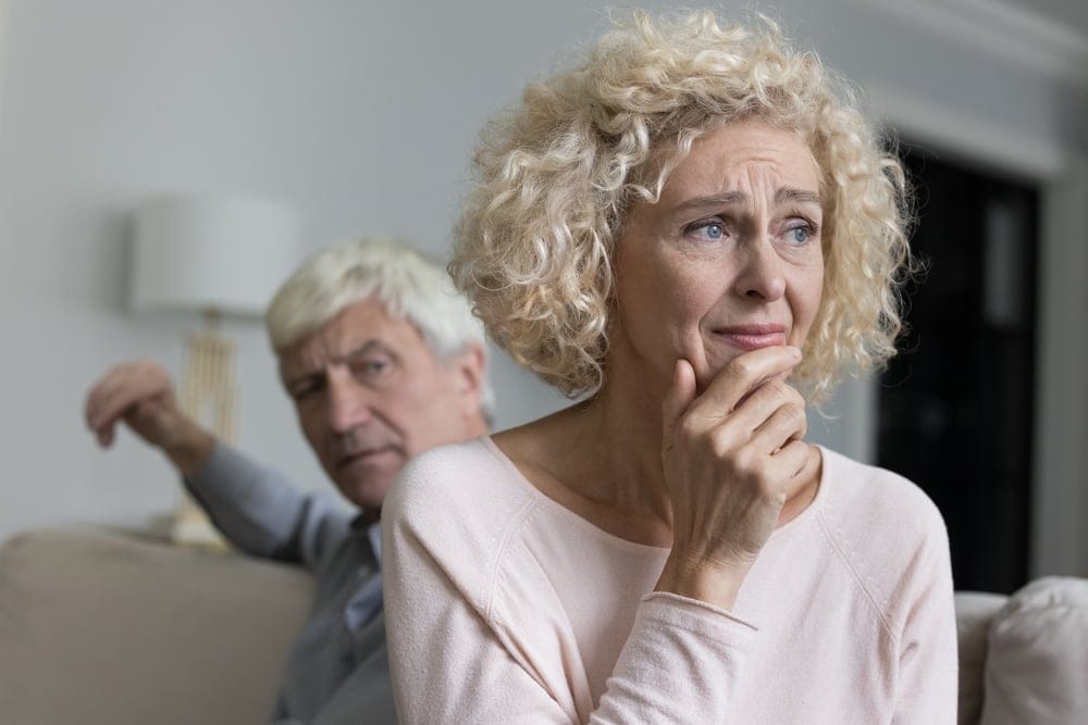 Close up of unhappy distressed older woman.