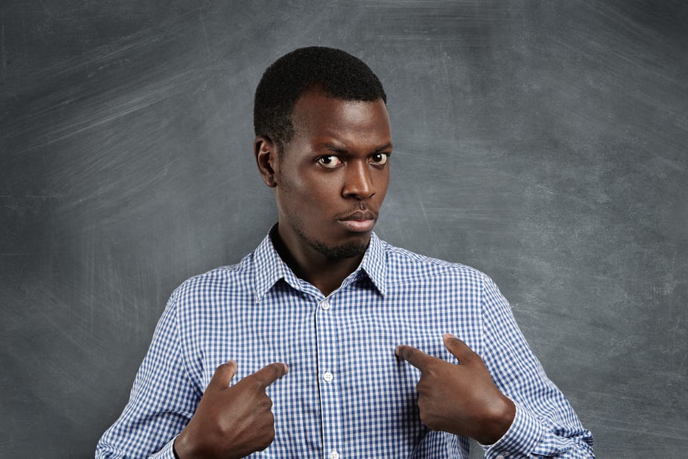 Man pointing at himself. 