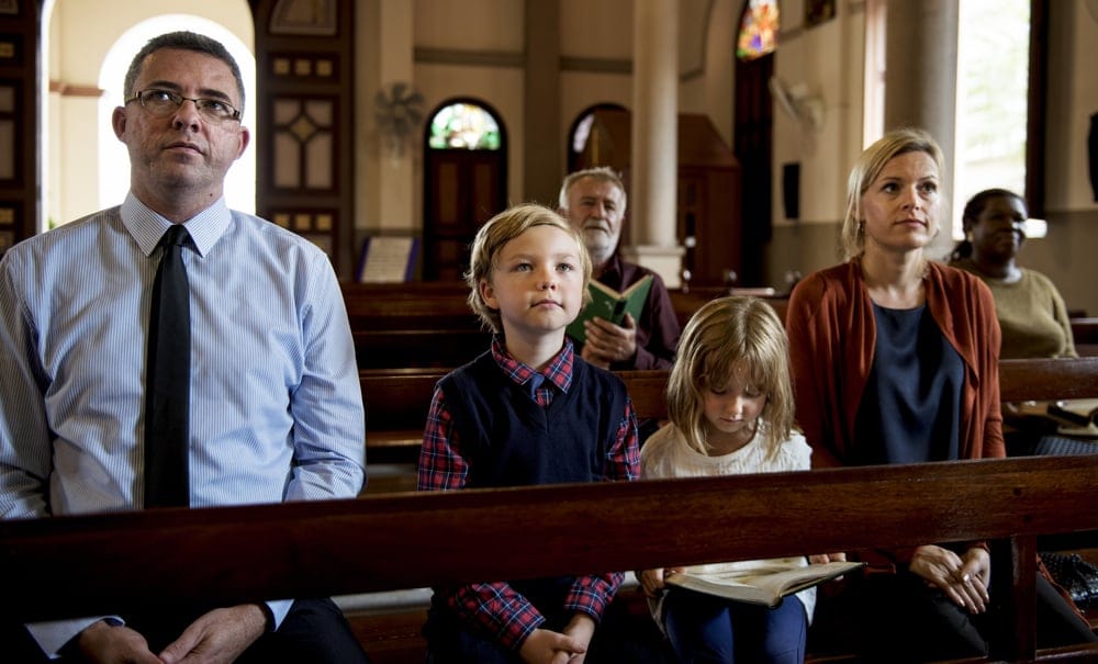 A family with children at mass.