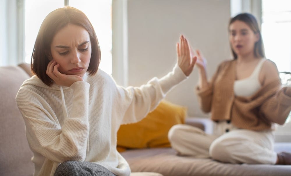 Woman saying no to her friend.