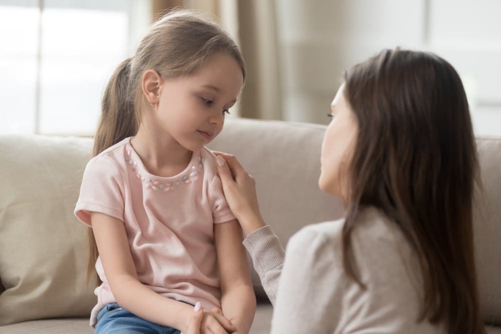 Mom speaking with her daughter.