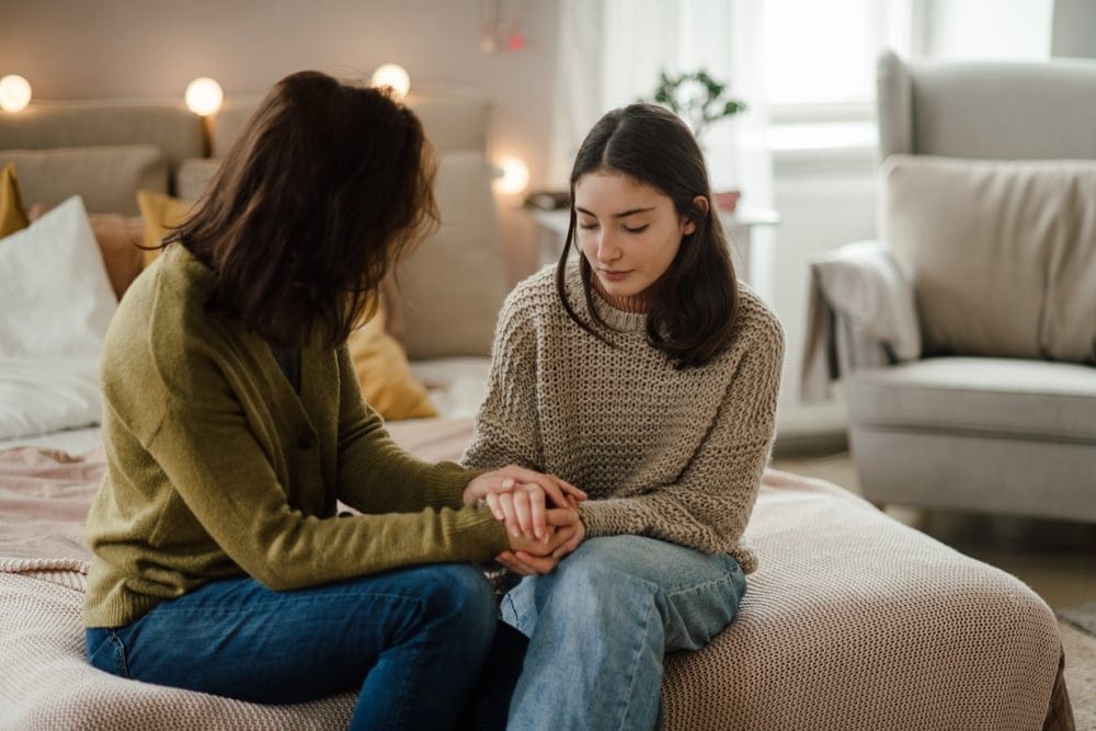 Mother with her teenage daughter having a talk.