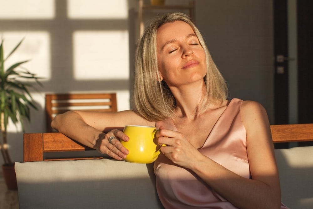 Woman enjoying her morning coffee.