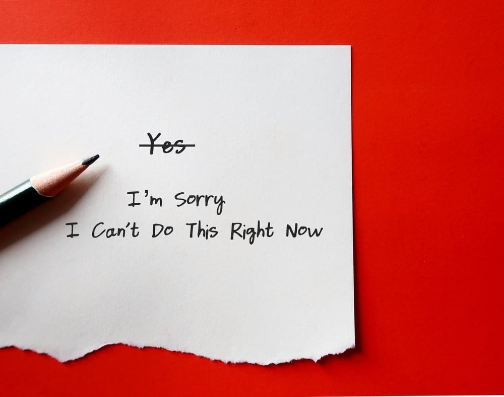 Paper and pen with a note saying no.