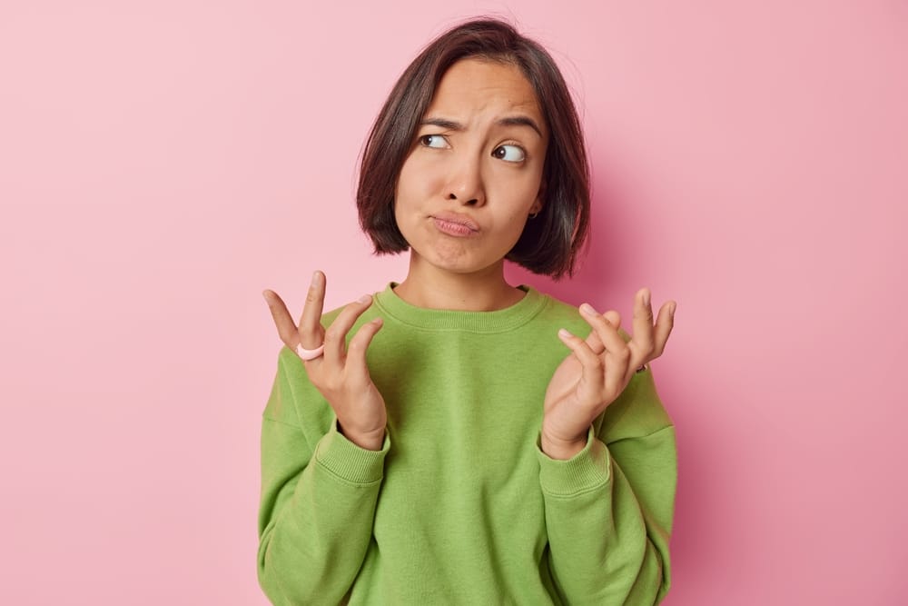 Young woman looking puzzled.