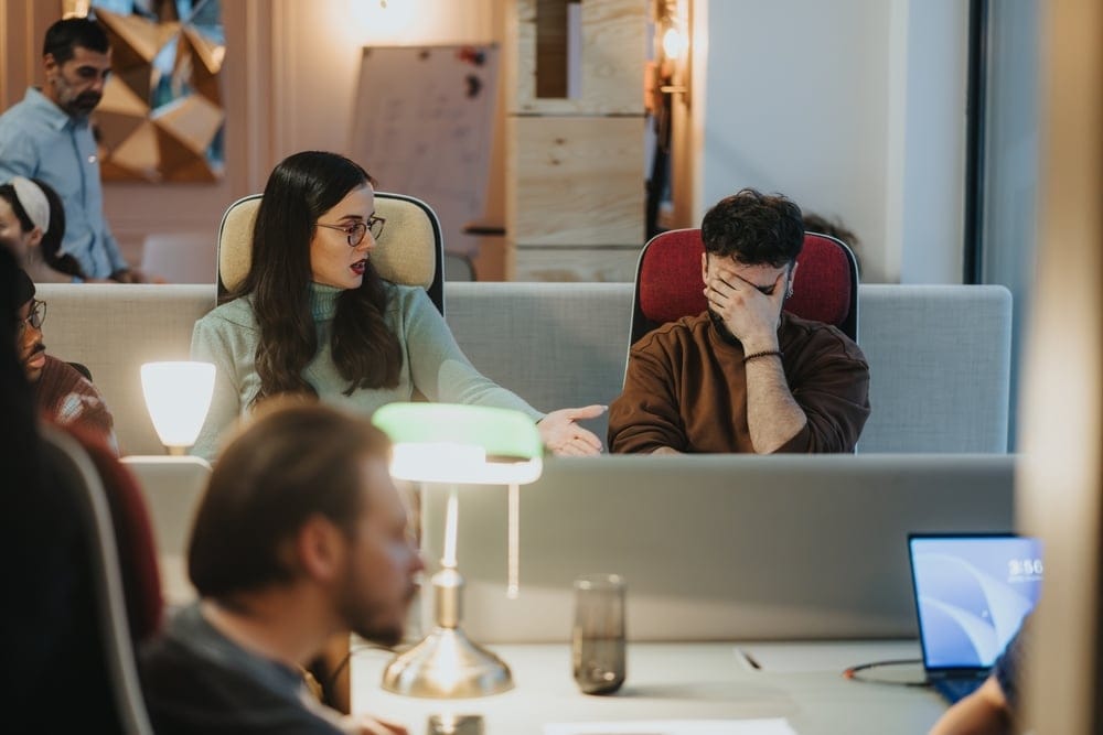 Office mates in a stressful meeting.