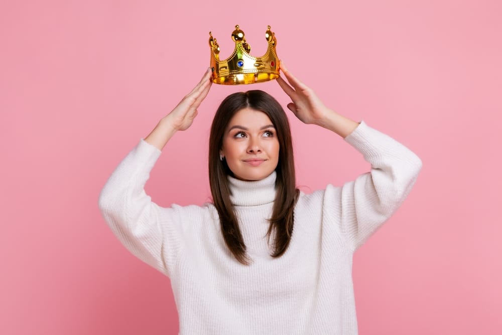 Woman wearing a gold crown.