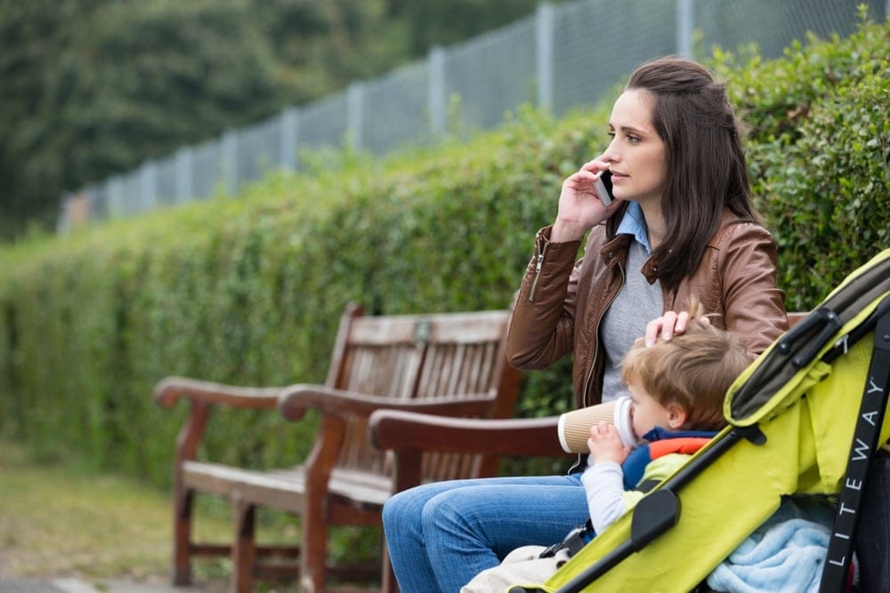 Woman with her children at the park.