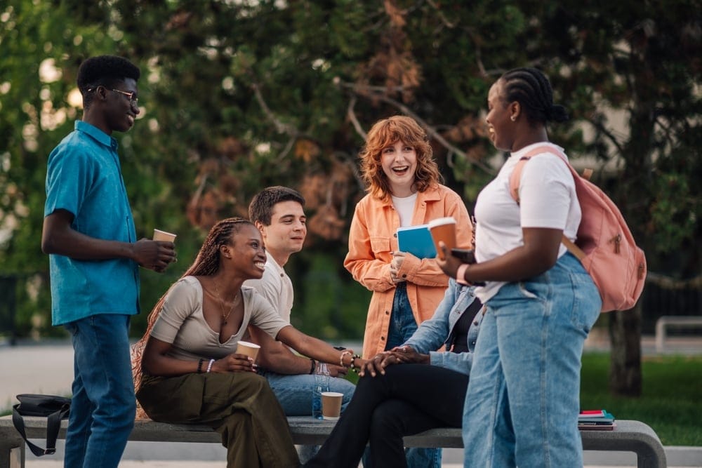 Group of friends gathering outside.