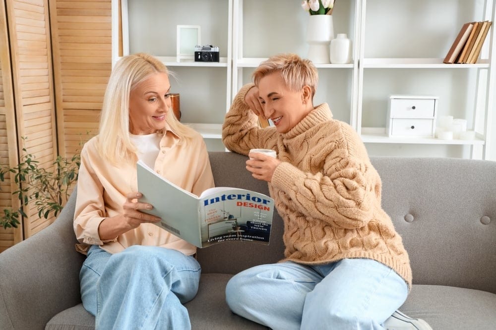 Woman reading a magazine on the couch.