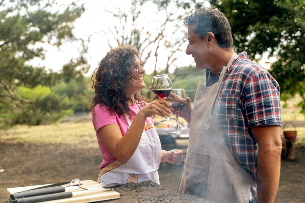 Couple sharing a glass of wine together.