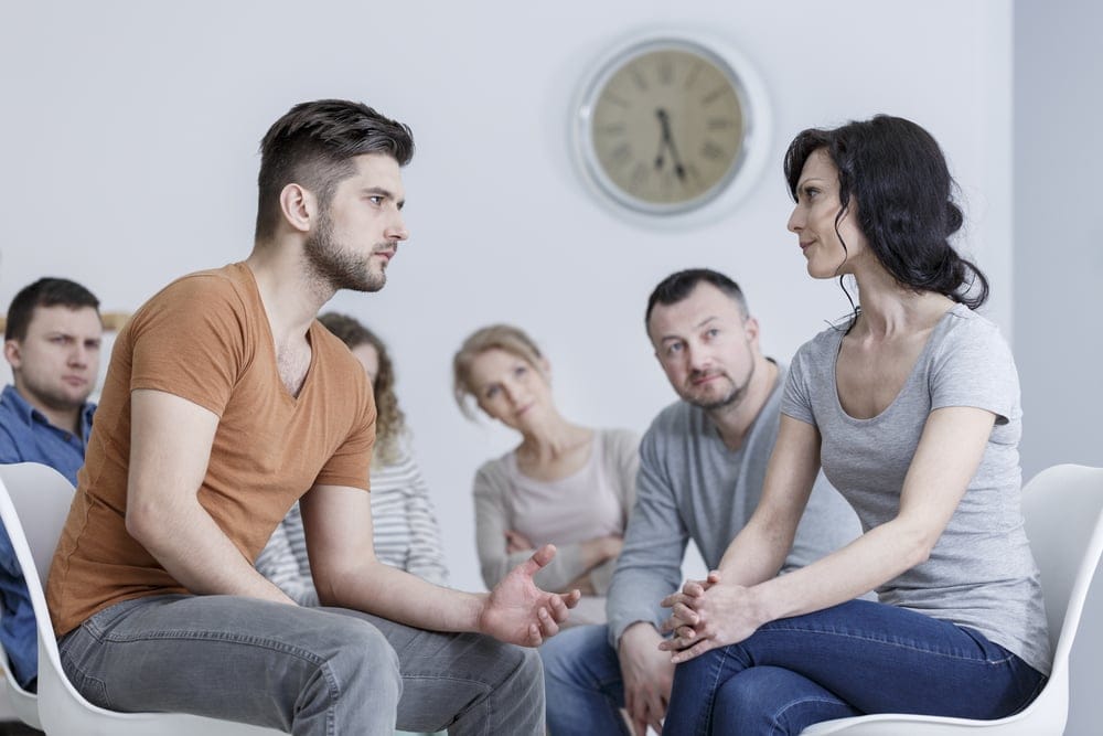 Couple with their in-laws at home.