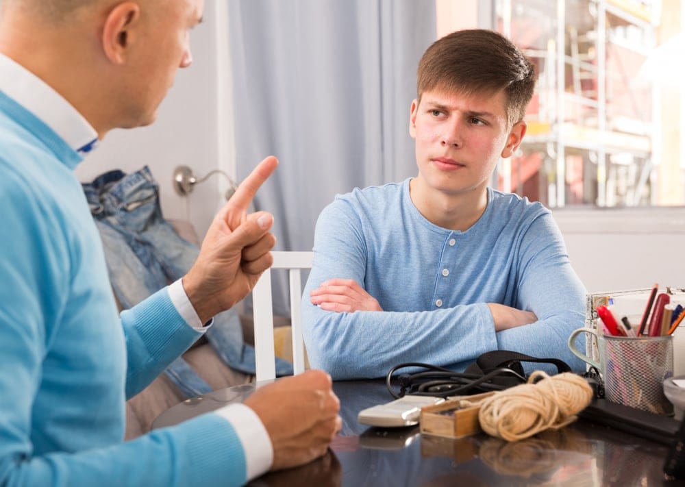 Father and son in an intense conversation.