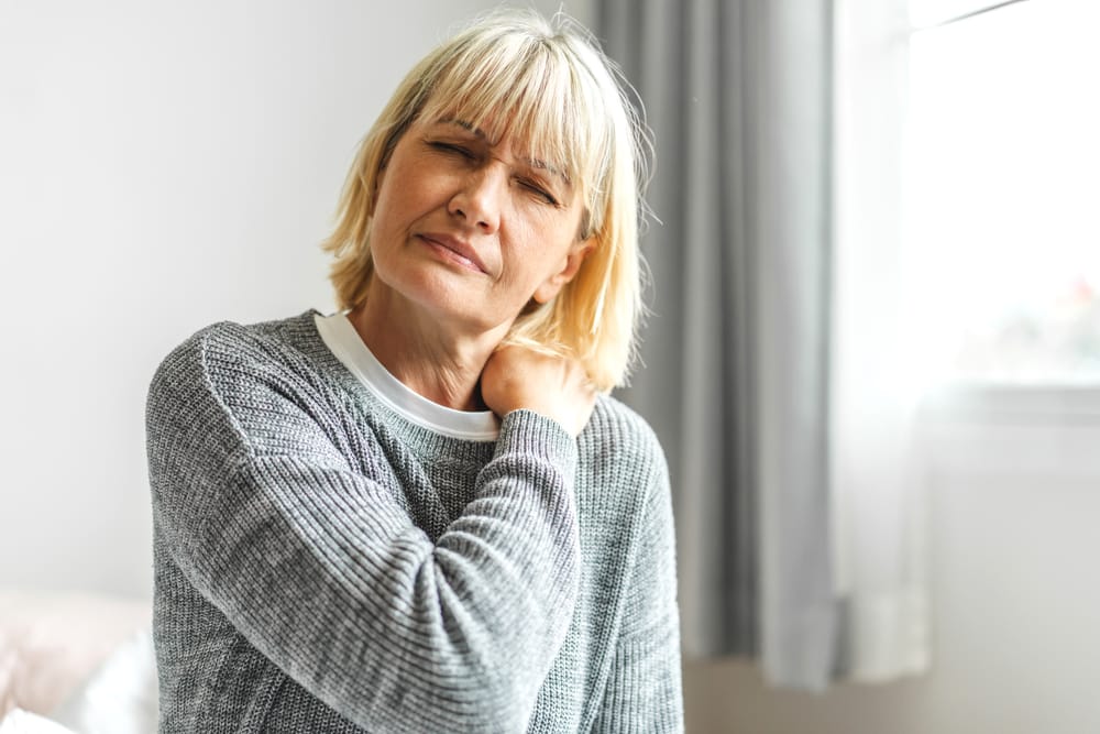 Senior woman feeling ill.
