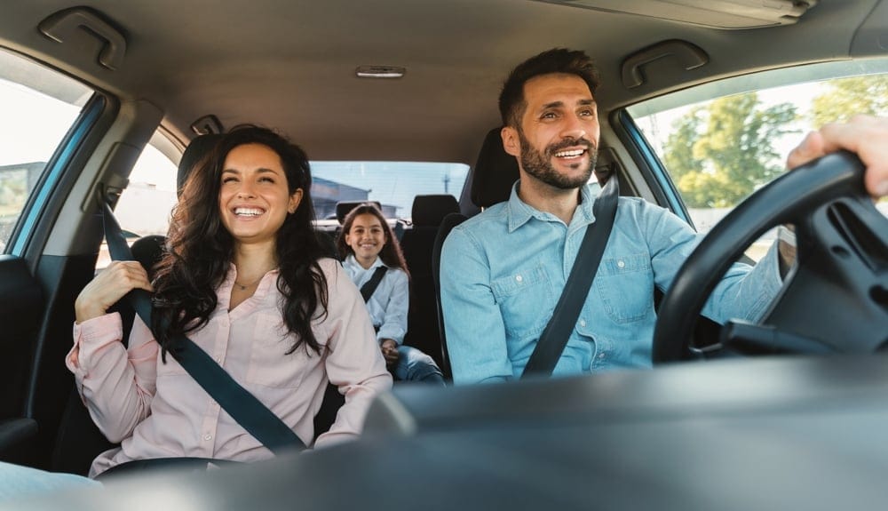 Happy family in the car.