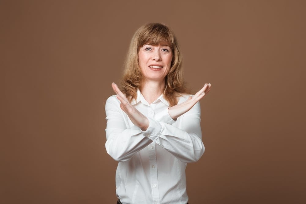 Self-assured,Middle-aged,Woman,In,Her,Prime,Assertively,Gesturing,With,Hands