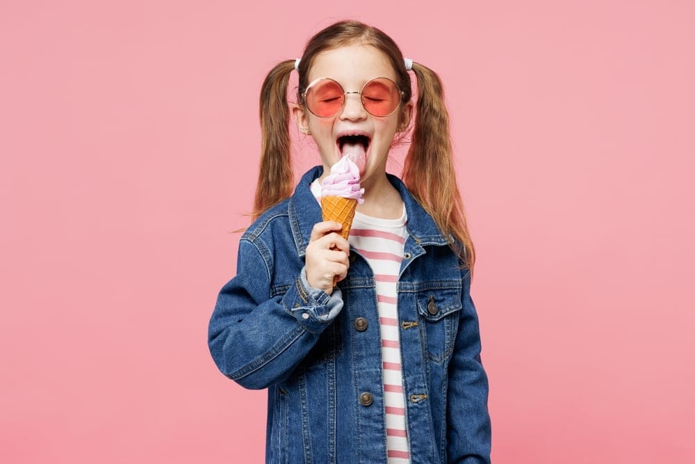 Little girl eating ice cream.