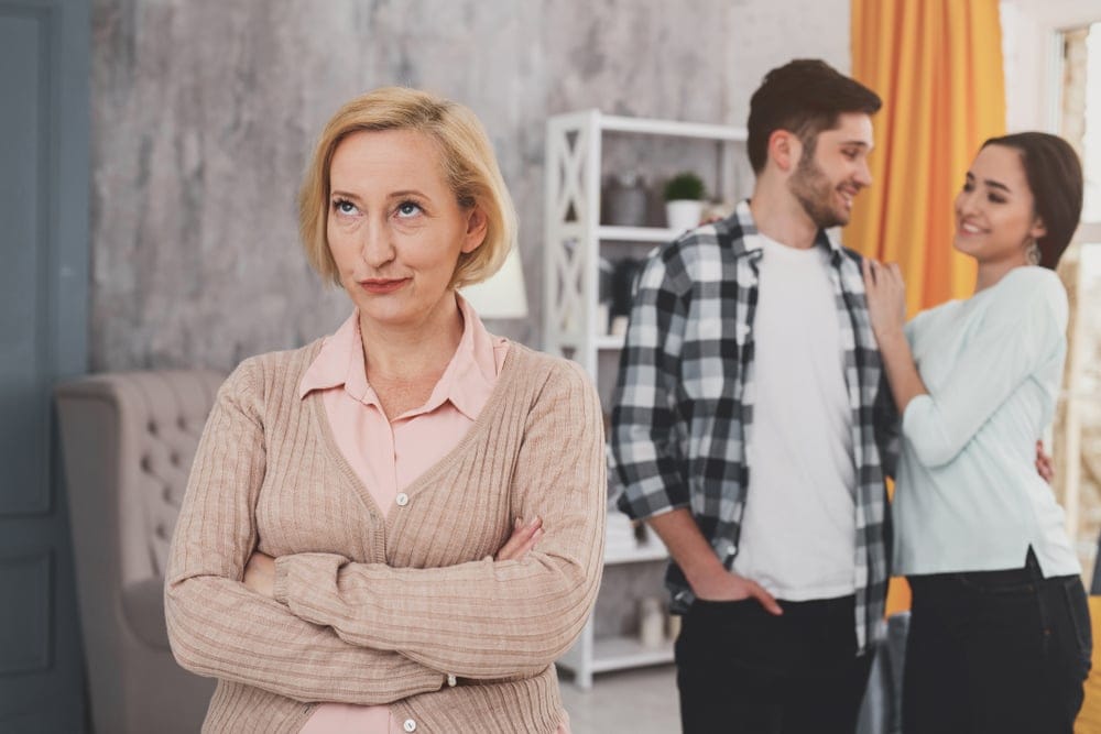 Mother and son in an argument while she rolls her eyes at him.