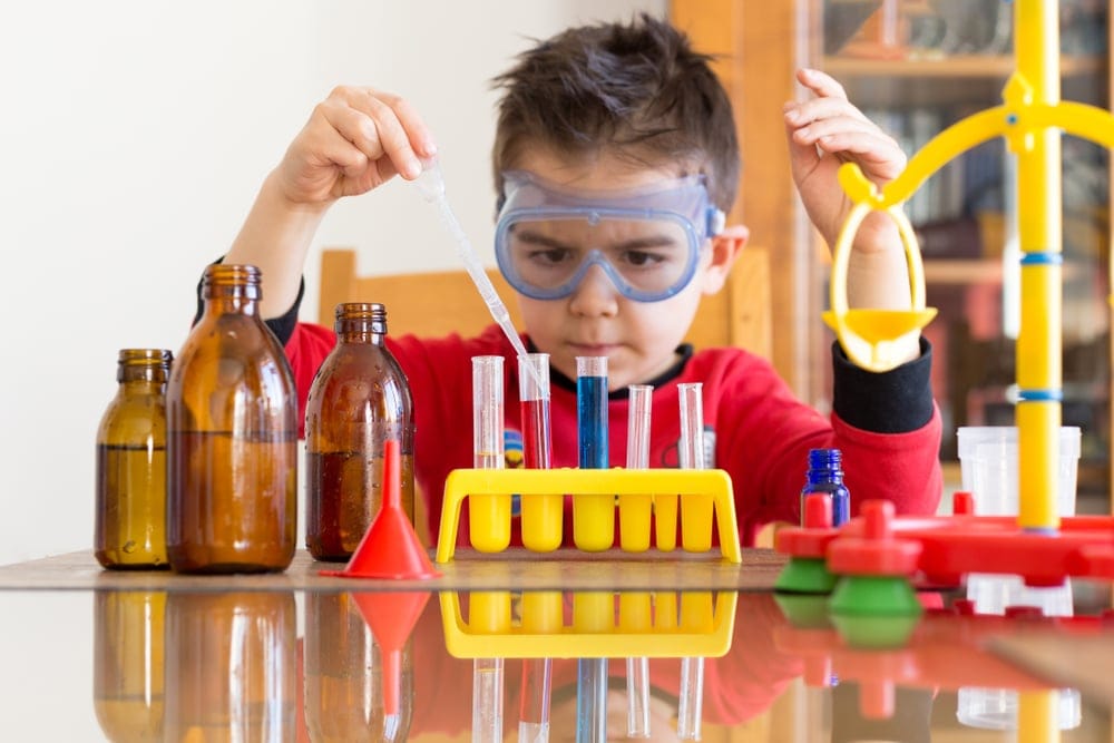 Young boy in science class.