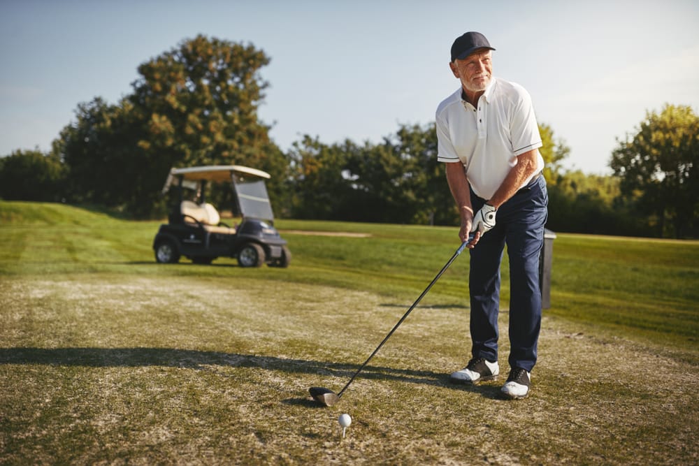 Man playing golf.