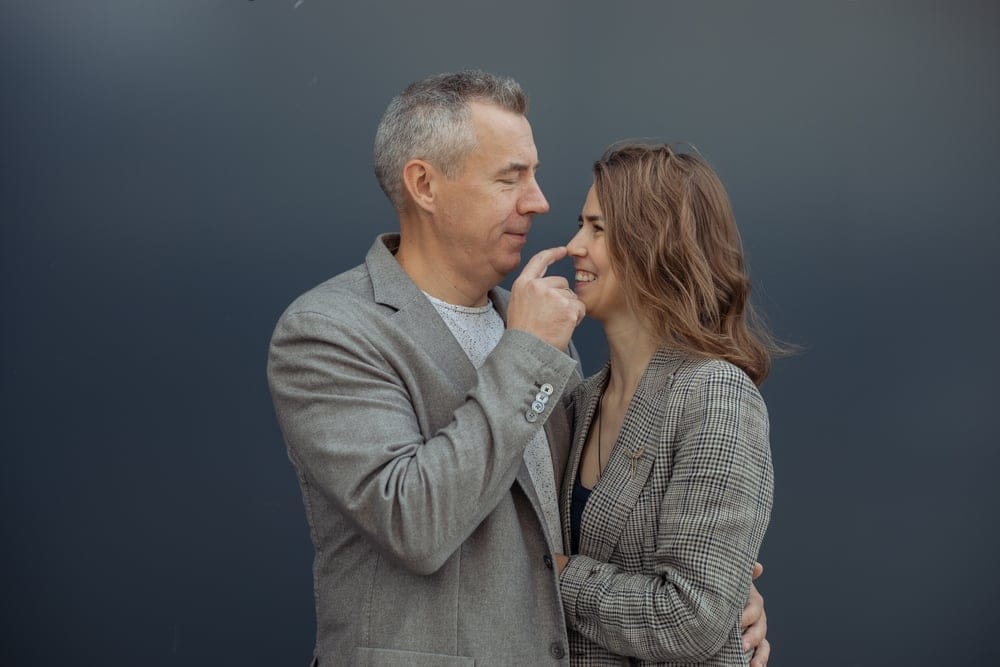 Man and wife embracing.