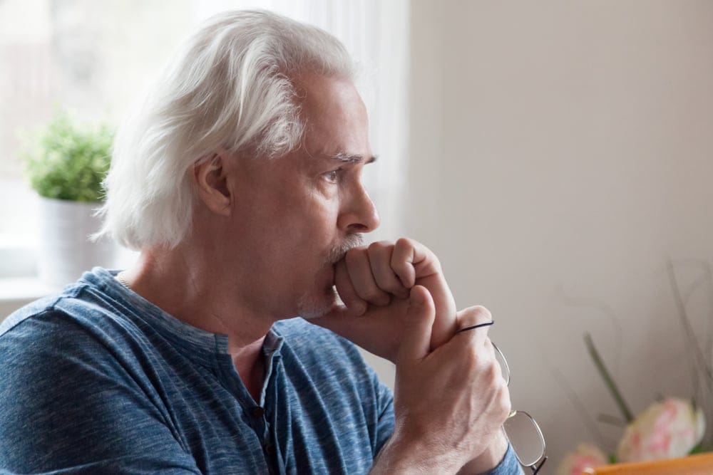 Man sitting alone thinking.