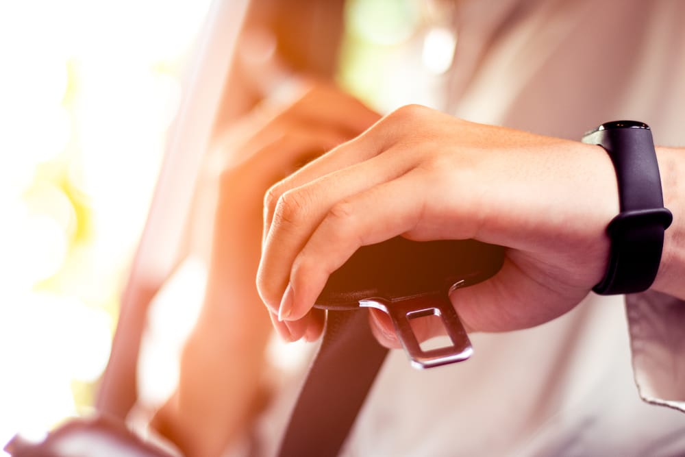 Man fastening his seatbelt.
