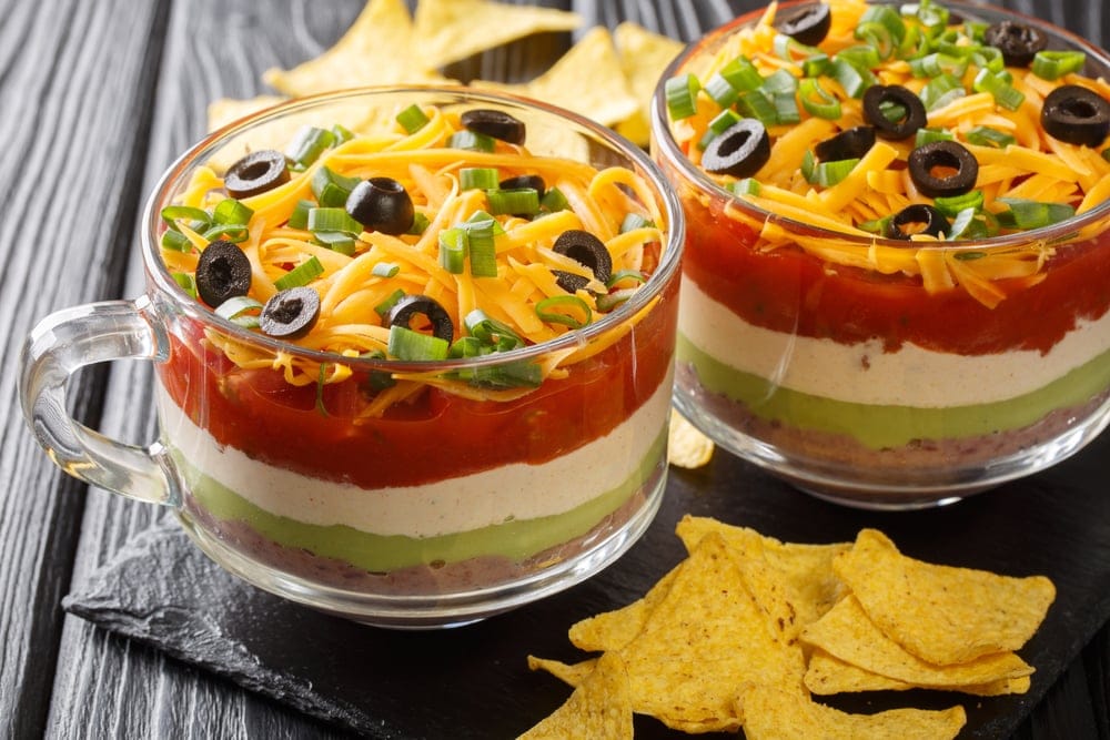Mexican dip with tortilla chips.