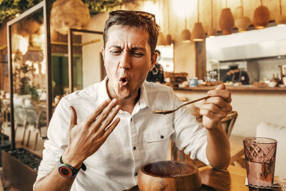 Man eating spicy food.