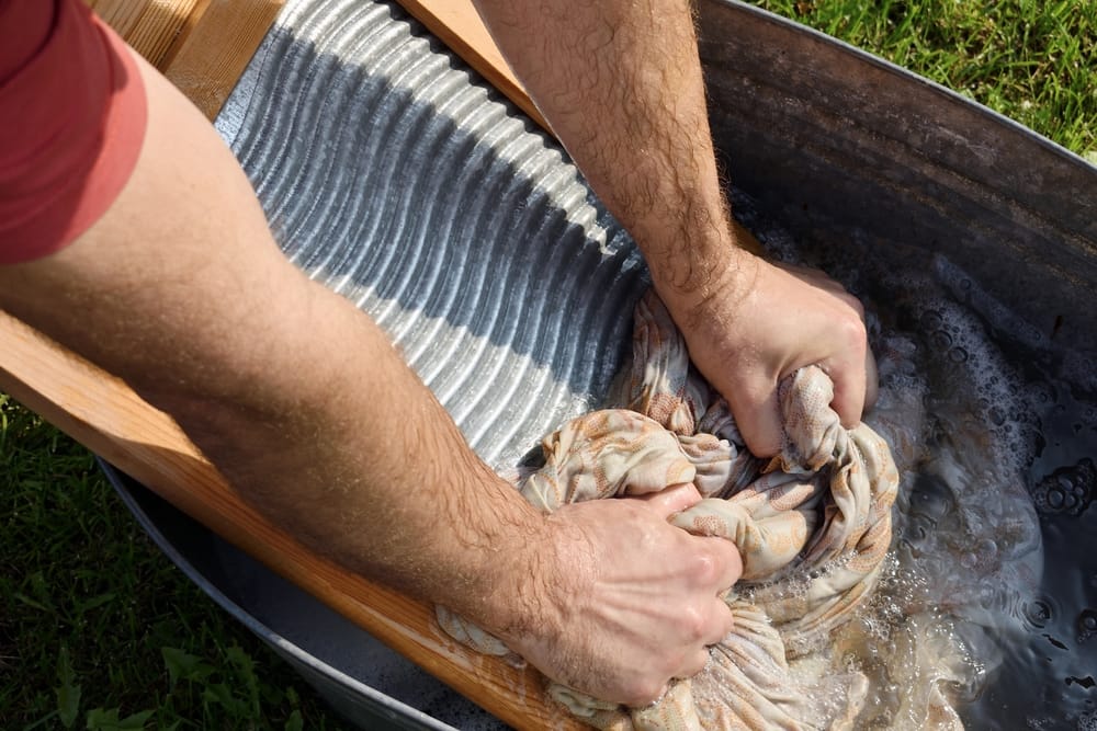 Man washing clothes by hand. 