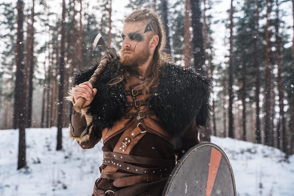 Man dressed as a Viking warrior.