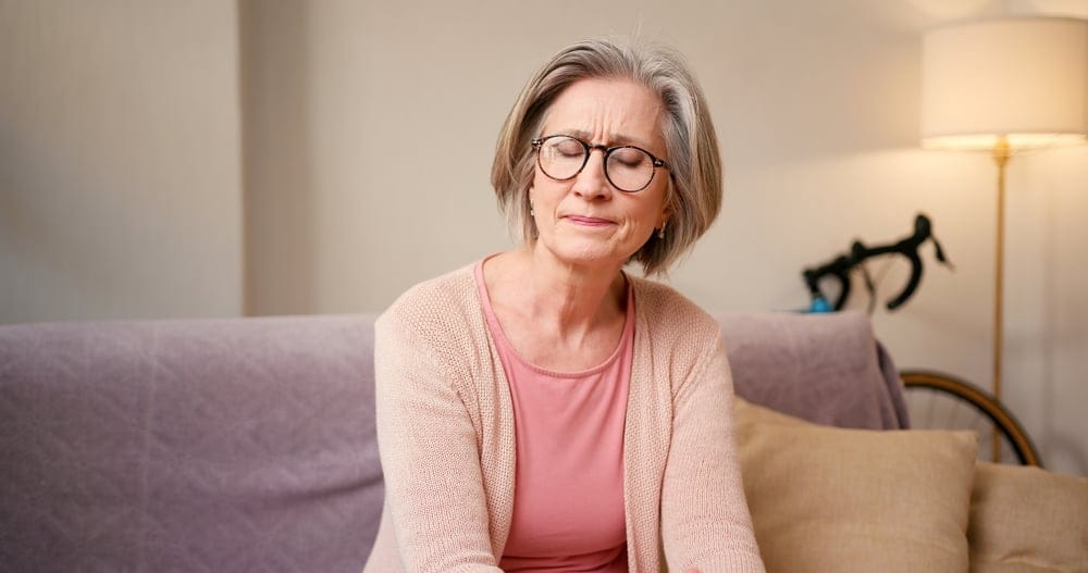 Senior woman looking stressed.